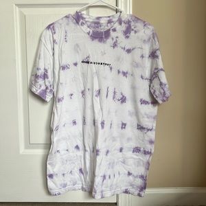 Medium purple tie dye Seek Discomfort tee shirt.